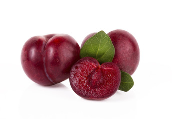 plums isolated on white