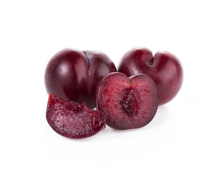 plums isolated on white
