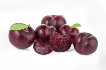 plums isolated on white