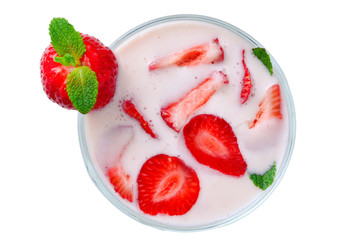 Fresh strawberry in a white plate on table, top view.