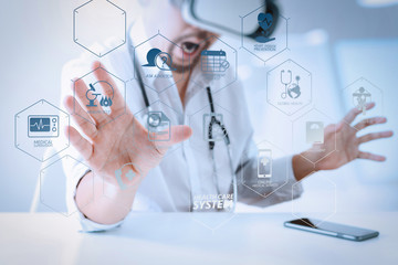 smart doctor wearing virtual reality goggles in modern office with mobile phone using with VR headset