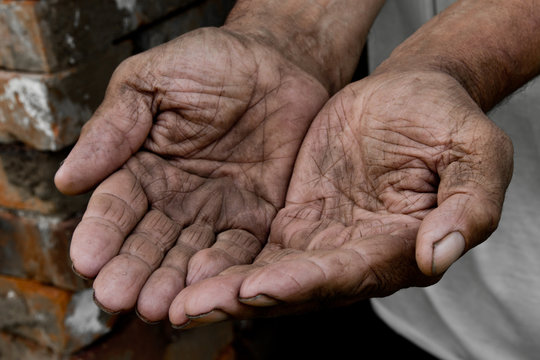 Hands poor poverty elder man begging you for help. Concept hunger people or poverty. Selective focus. Poverty in retirement.