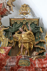 Fototapeta na wymiar Angel, statue on altar in cathedral of Assumption in Varazdin, Croatia