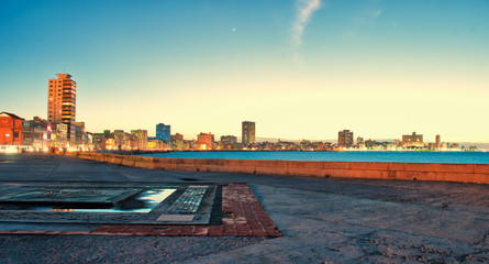 view of the malecon in the city of Havana at sunset in Cuba