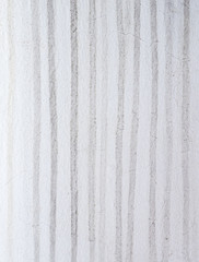 Long stain on the white house wall.