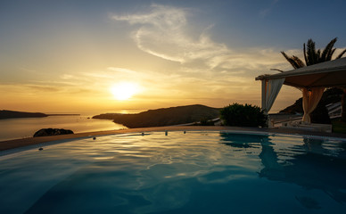 Infinity pool at dusk in Santorini, Cyclades Islands, Greece