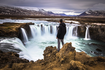 Godafoss - May 07, 2018: Traveler in Godafoss waterfall, Iceland