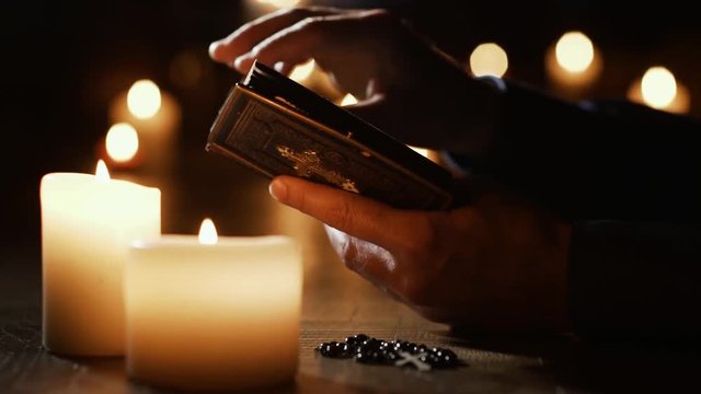 Man reading the Holy Bible and praying in the Church
