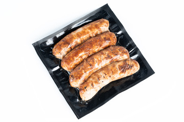 The grill sausages in plastic pack.