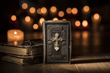 Antique precious Bible and Holy rosary in the Church