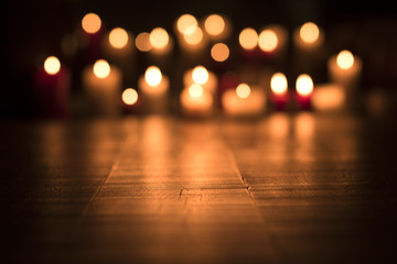 Lit candles burning in the Church