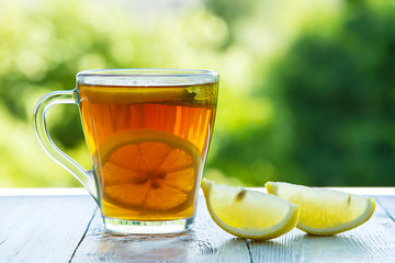 summer cold cup of tea on a wooden table