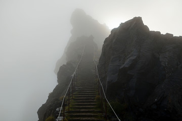 Mountain trail stairs in a fog leading to heaven, Pico do Areeiro, Madeira, Portugal - Powered by Adobe