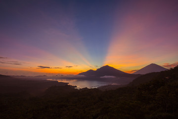 Scenic sunrise and mist at Agung volcano, Kintamani, Bali, Indonesia. Sunrise view of Agung volcano, nature landscape