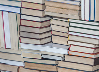 Stack of chaotically stacked books. Close-up.