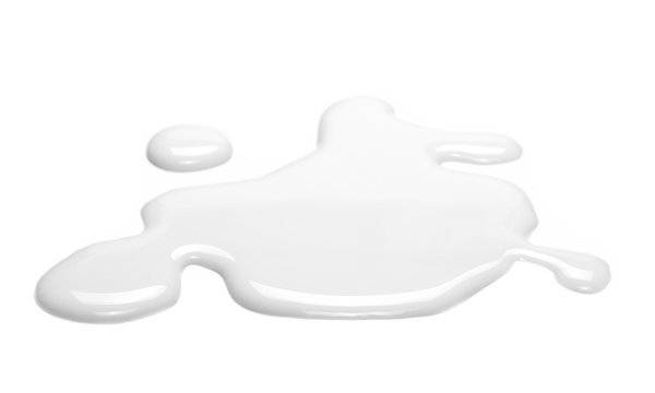 Spilled milk puddle isolated on white background and texture