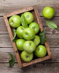 Fototapeta na wymiar Green apples in wooden box