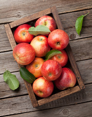 Red apples in wooden box © evgeeenius