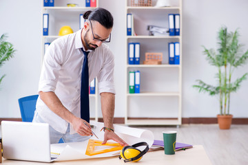 Architect working in his studio on new project