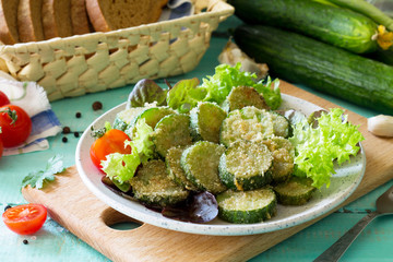 Fried zucchini or cucumber. Fast food on the kitchen table.