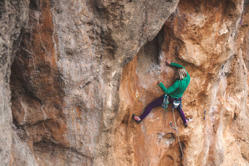 A rock climber on a rock.