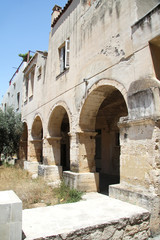 Fototapeta na wymiar Arches of the building of the former monastery of St. Nicholas in Crete in Chania