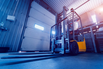 Forklift loader. Pallet stacker truck equipment at warehouse