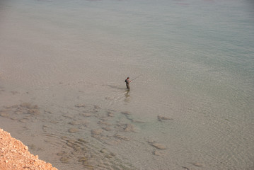 Man fishing in the Mediterranean 
