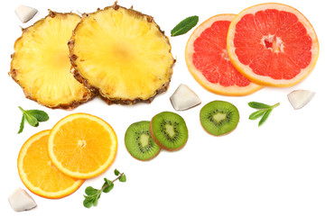 healthy background. slices of grapefruit, kiwi fruit, orange and pineapple isolated on white background top view