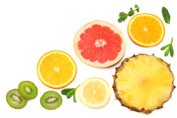 Fototapeta na wymiar healthy background. slices of grapefruit, kiwi fruit, orange and pineapple isolated on white background top view