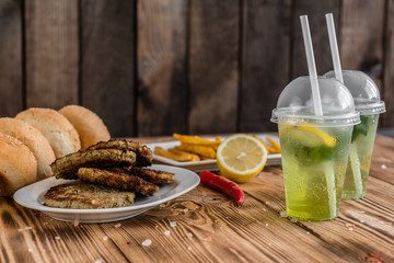 Tasty hamburger with meat and vegetables against a dark background. Fast food. It can be used as a background