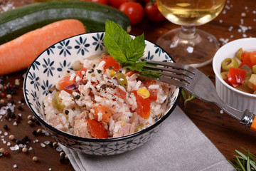 Bowl with rice salad and seasoning  