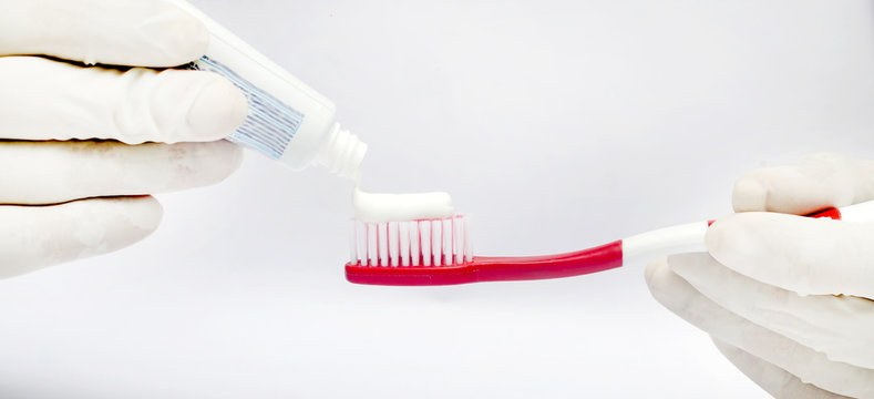 Tooth brushing tecnique with toothpaste isolated in white background