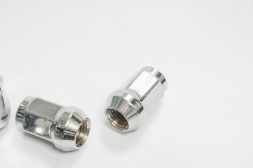 Car service, nut of fixture of a wheel of the car on a white background,