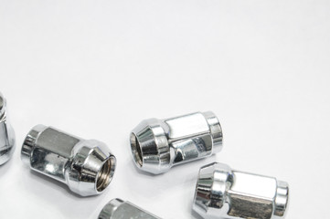 Car service, nut of fixture of a wheel of the car on a white background,