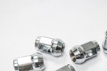 Car service, nut of fixture of a wheel of the car on a white background,