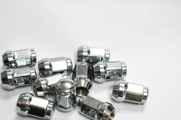 Car service, nut of fixture of a wheel of the car on a white background,