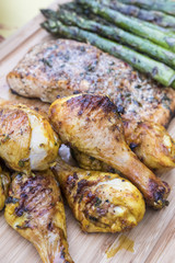 Barbecued Chicken, Salmon and Asparagus on a Bamboo Cutting Board