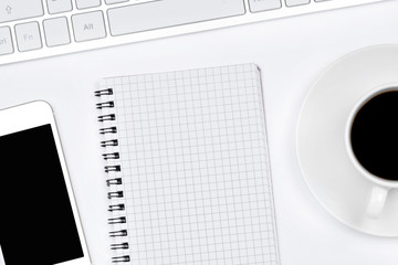 Fototapeta na wymiar Empty notepad with coffee, keyboard computer and telephone on white background