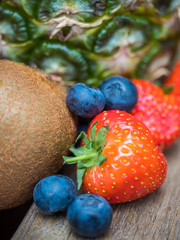 Closeup of strawberries, blueberries and pineapple