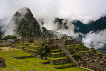 View of the ancient Inca City of Machu Picchu. The 15-th century Inca site.'Lost city of the Incas'. Ruins of the Machu Picchu sanctuary. UNESCO World Heritage site. - obrazy, fototapety, plakaty