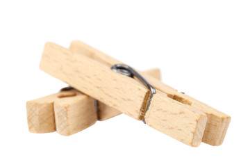 Wooden clothespins isolated on a white background.