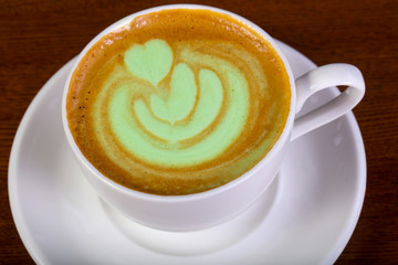 Green cappuccino with cream