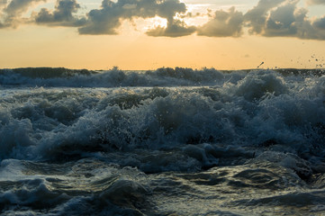 Amazing sea sunset, the sun, waves, clouds
