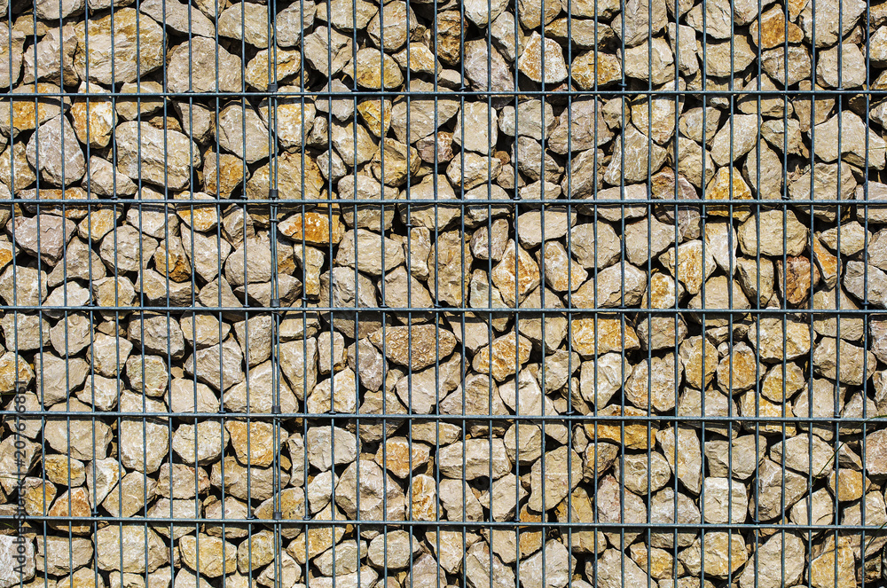 Wall mural detail of gabion wall filled with stones