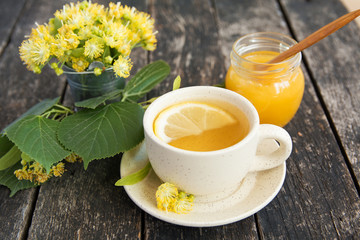 linden flowers, herbal medicine, Cup of healthy  tea with honey and lemon.  alternative or complementary medicine, traditional medicine. soft focus image