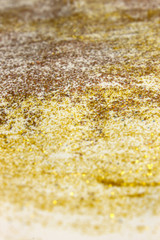 Orange, Yellow,Gold and Bronze shiny textured Glitter paint on a White background