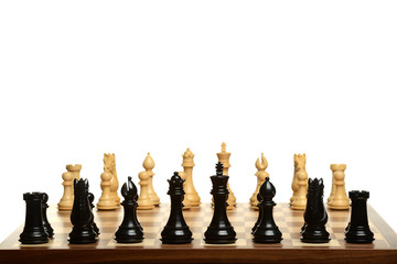 Chess set with black pieces on foreground