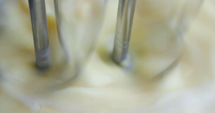 Very close video of banana cream pudding being mixed with dual beaters.