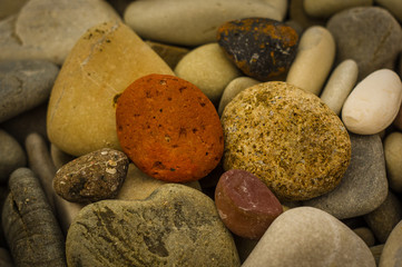 boulders and colorful pebbles on the beach